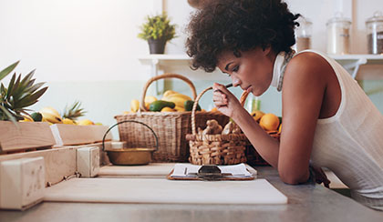 Female business owner reading paperwork.