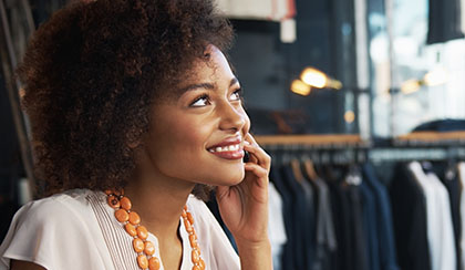 Woman on phone and smiling.